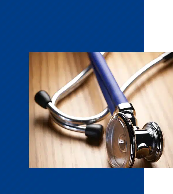 Stethoscope on wooden background.